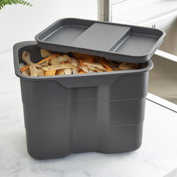 the 4.2L food caddy can nestlein one of the lrage 32L bins and popped on the worktop or hung off  a door whilst in use
