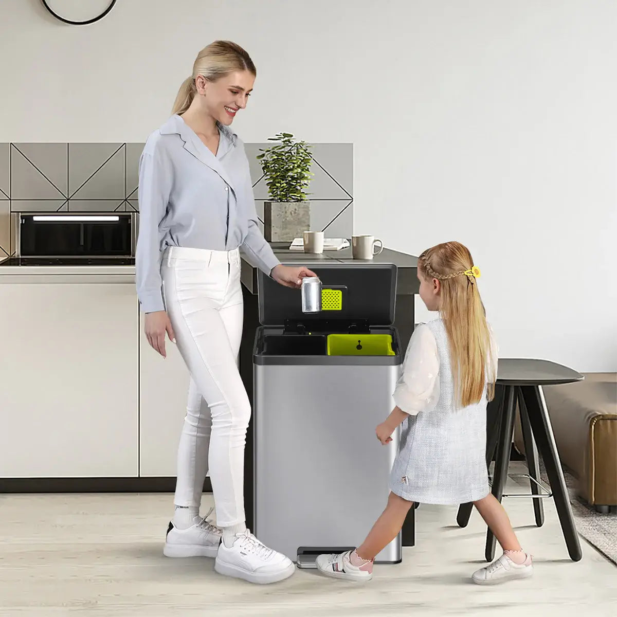 Stainless steel waste bin with black accents in a family kitchen