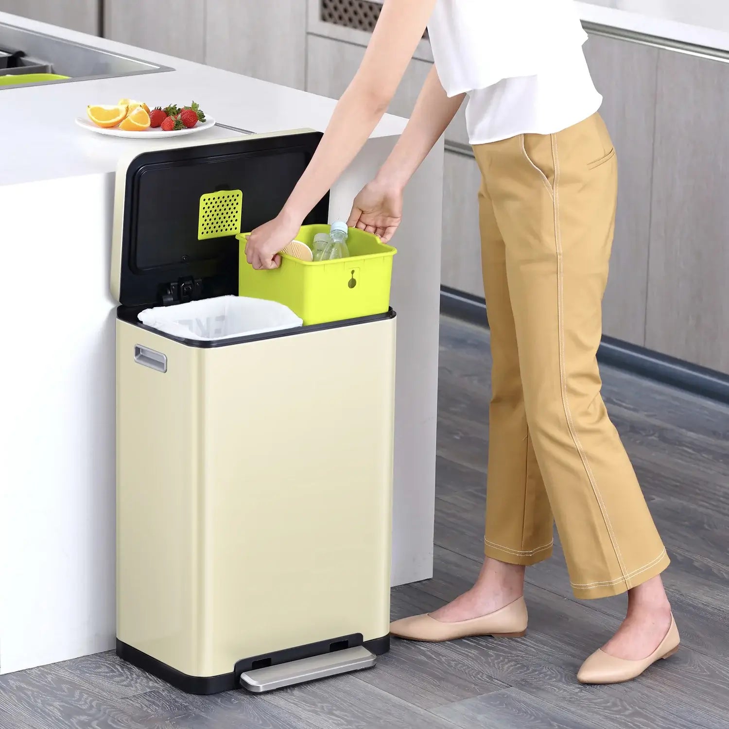 Person using a Cream waste bin in a modern kitchen