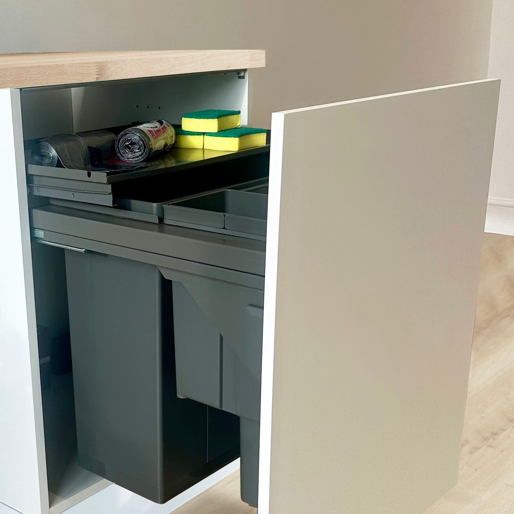 Wesco Pullboy Soft Comfort pull-out odour tray with kitchen cleaning materials and bin liners.