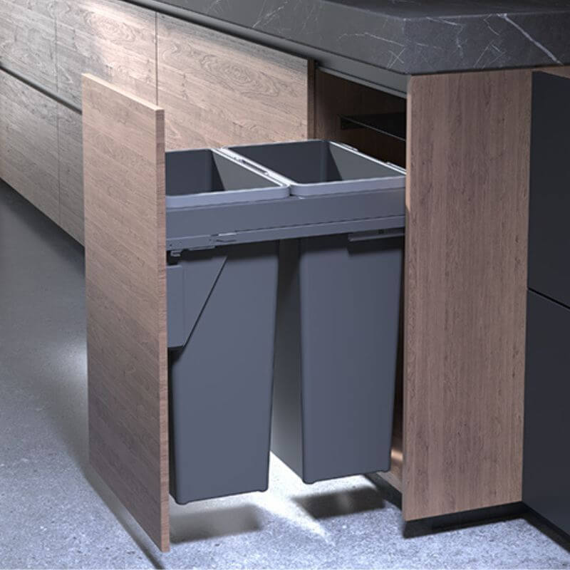 grey waste bins in a wooden cabinet with a gray floor.