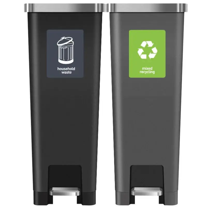 Grey and black pedal bin on a white background